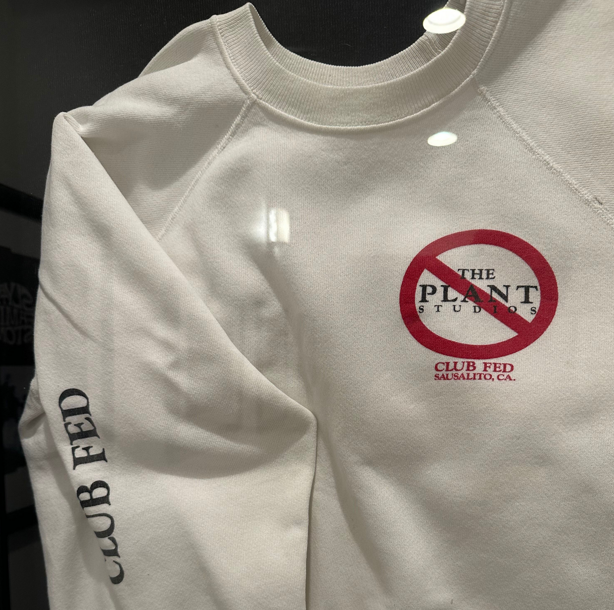 Vintage 'Club Fed — Sausalito, CA' sweatshirt with a crossed-out Plant Studios logo.