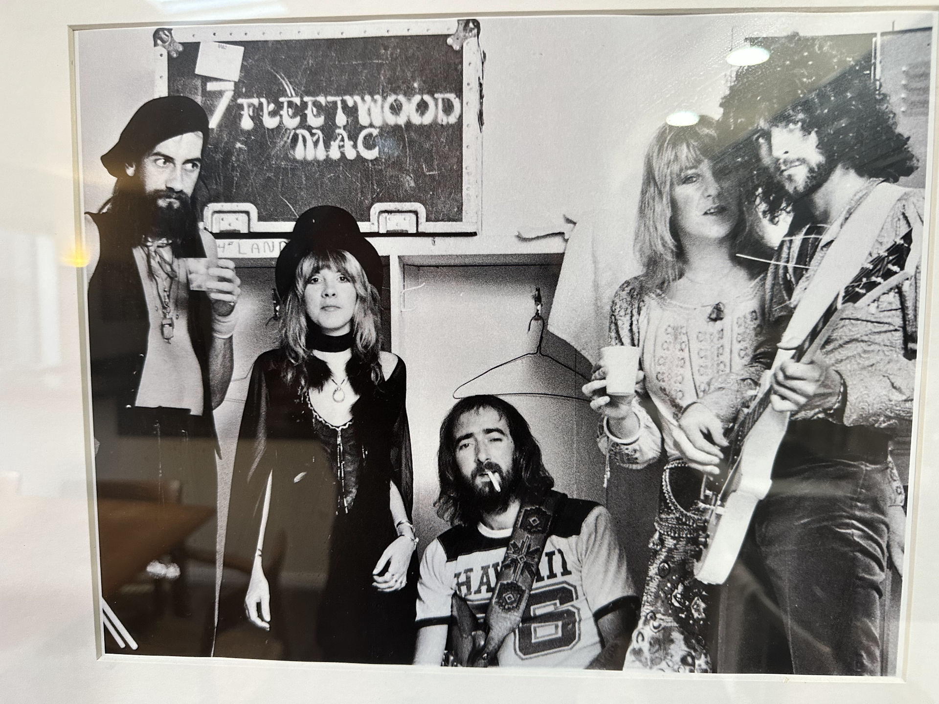 Framed black-and-white photo of Fleetwood Mac at 2200 Bridgeway in 1976, standing in front of a Fleetwood Mac road case.