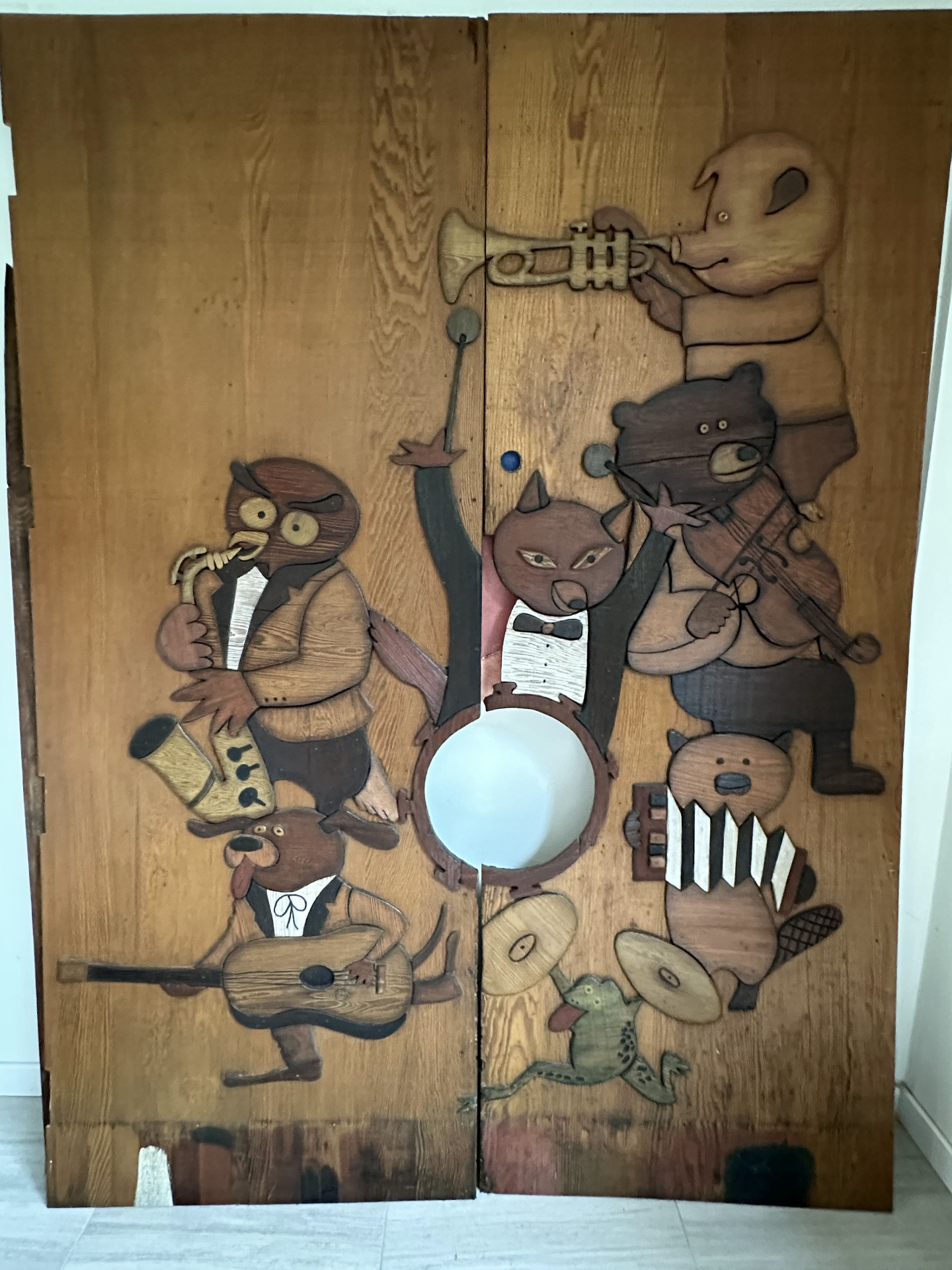The original carved redwood front door of the Record Plant Sausalito — a band of animals playing instruments, including a bear with a violin whose nose Stevie Nicks reportedly rubbed for luck.