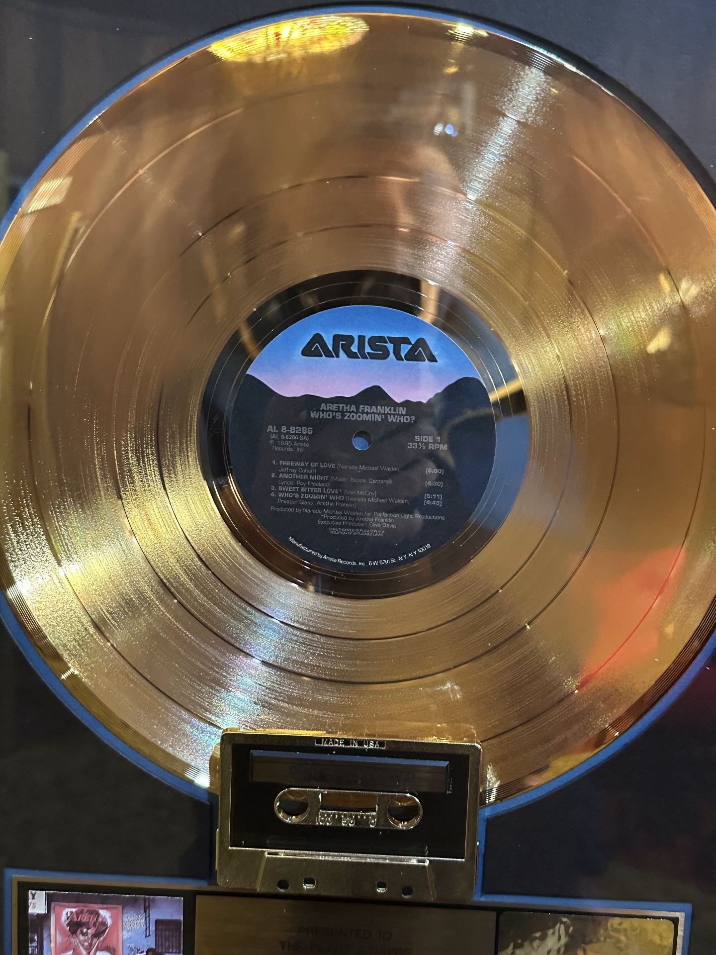 Close-up of the gold record award for Aretha Franklin's 1985 album Who's Zoomin' Who? on Arista Records.