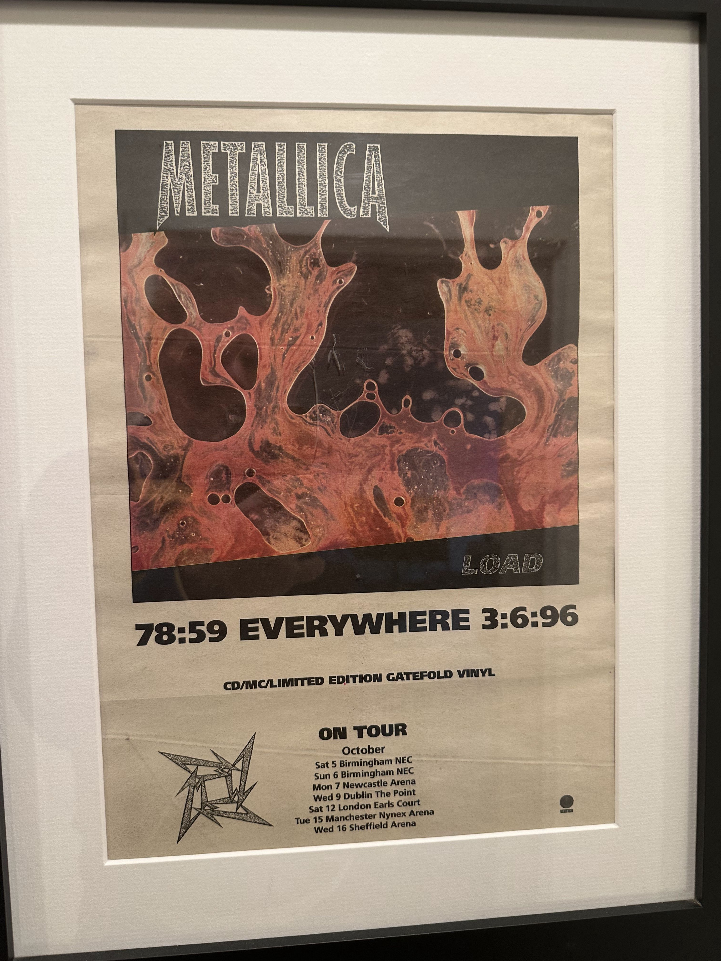 Framed 1996 promotional poster for Metallica's Load album with UK tour dates, including Birmingham NEC and London Earls Court.