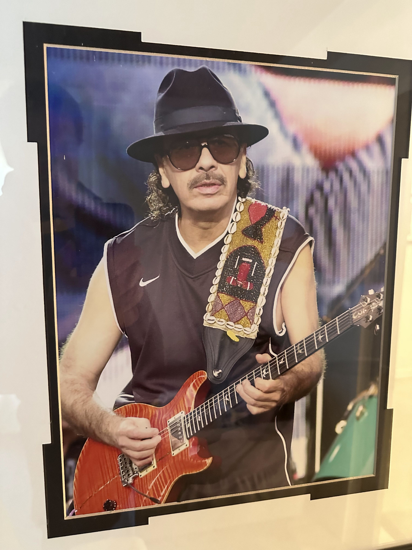 Framed photo of Carlos Santana on the wall at 2200 Studios