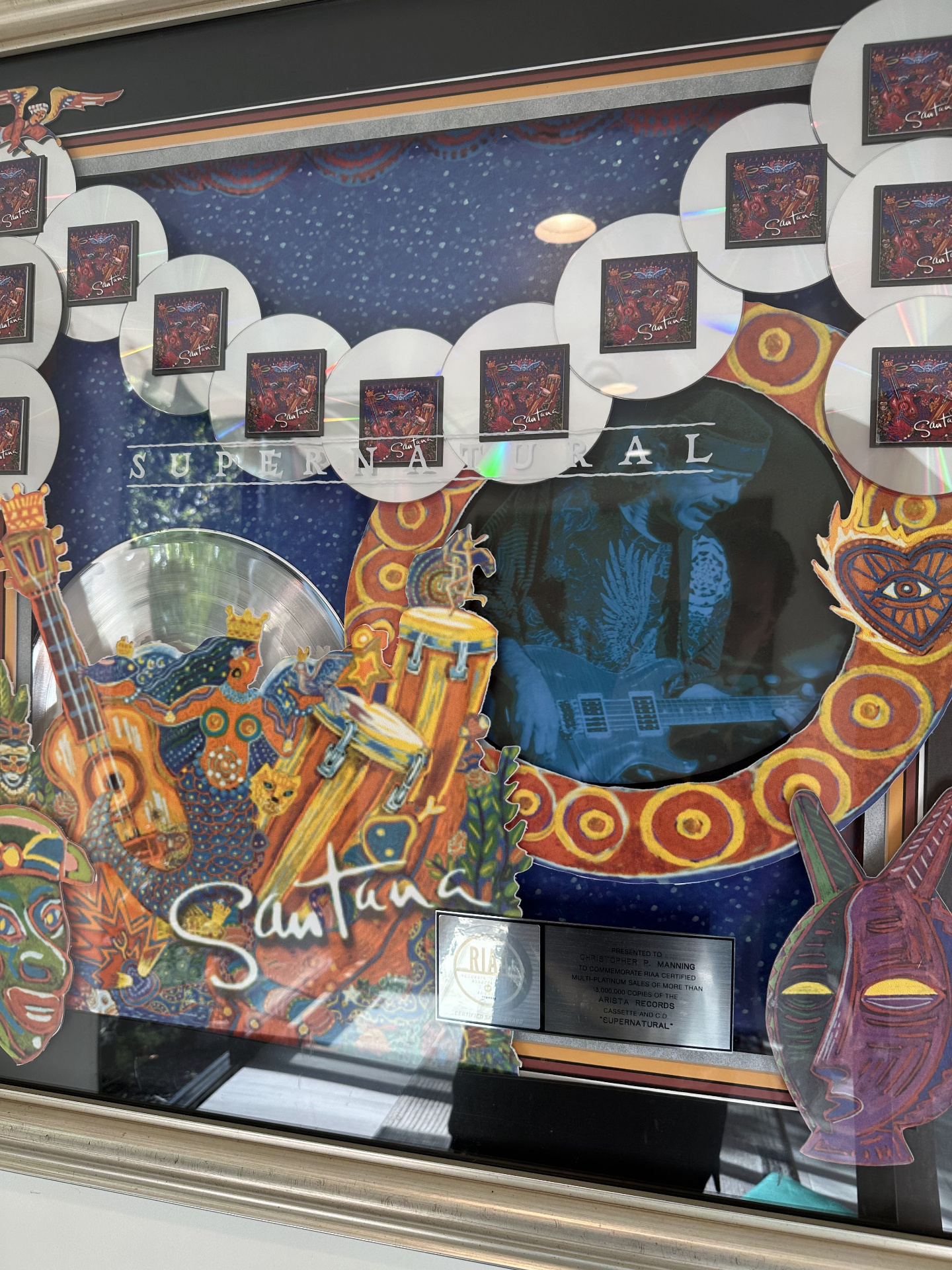 RIAA multi-platinum award for Santana's Supernatural — framed with CDs and album artwork