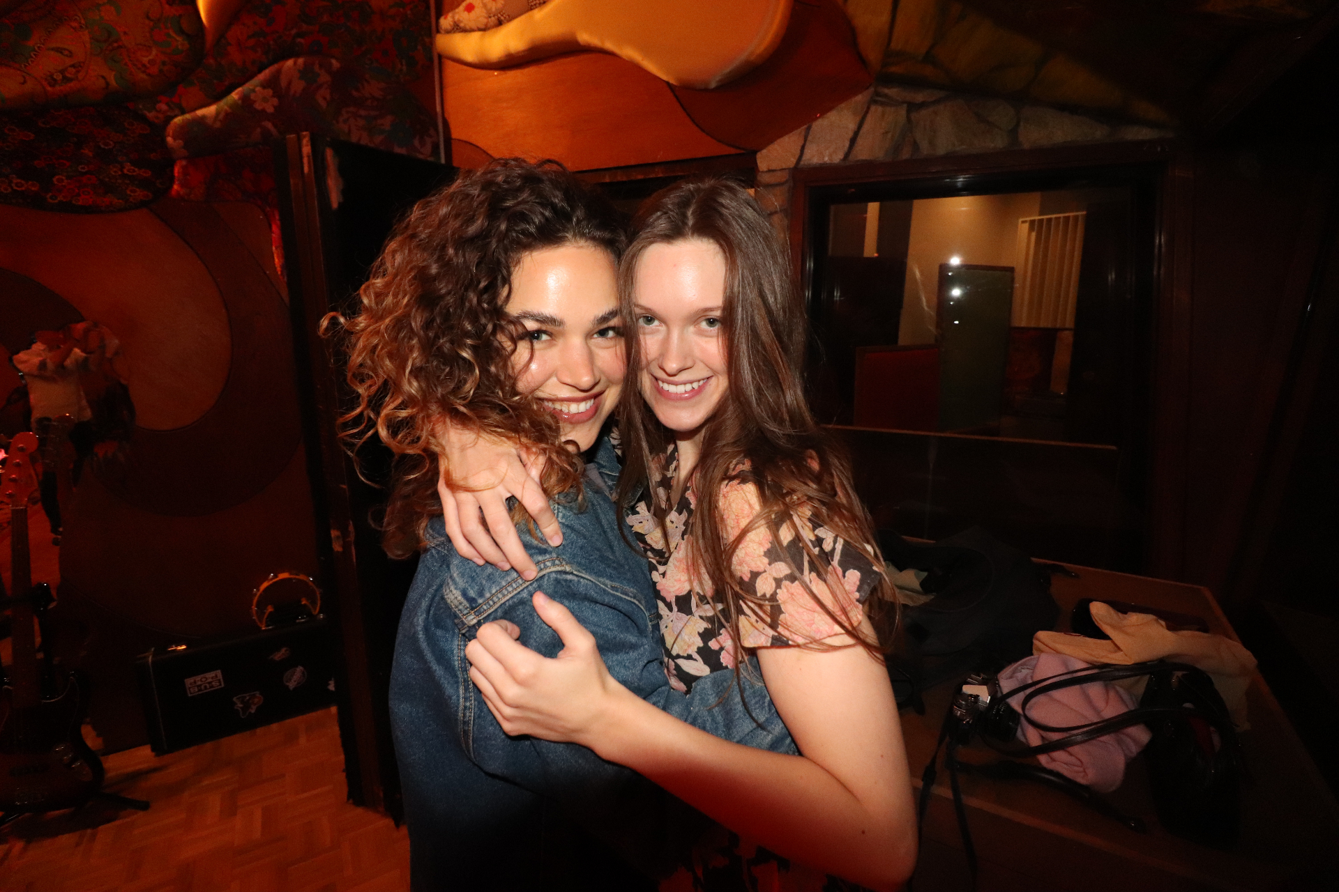 Two cast members embracing in Studio B.