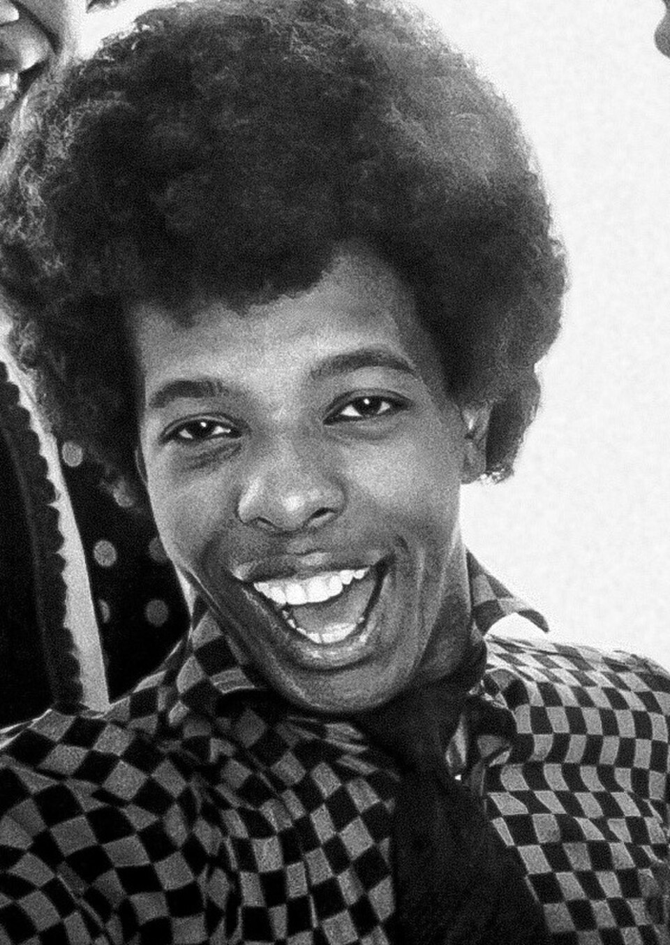Sly Stone, 1968 publicity photo — close-up black and white smiling